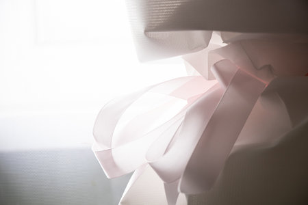 Flower wrap white with pink ribbon and bow on bouquet as background,flower wrapの写真素材