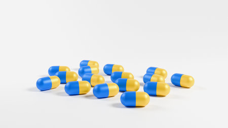 3D model of capsule tablets in the colors of the Ukrainian flag yellow blue on a white background, Ukrainian drug, medicineの写真素材
