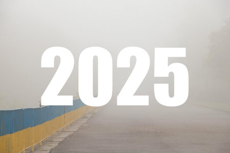 The number 2025 is written on the background of a fence in the colors of the Ukrainian flag, yellow...