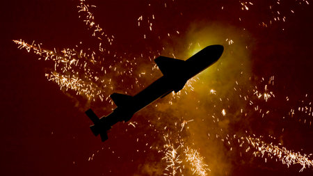 3D model of a ballistic missile against the backdrop of fireworks in the night sky, close-up of the...