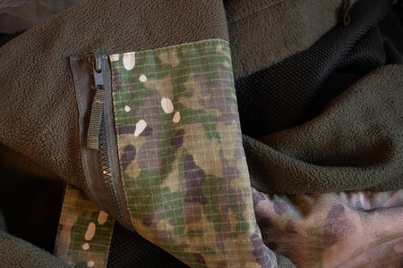 Camouflage uniform of Ukrainian soldier warm lies as background, soldier uniformの写真素材