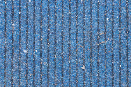 Dirty blue carpet with vertical lines lies on the street as a background, carpetingの写真素材