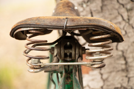 Old bicycle saddle outdoors close-up in summer in Ukraine, retro bicycleの写真素材