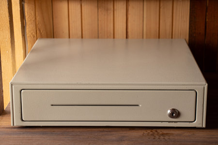 Cash drawer with lock stands on the table, business and trade, storing moneyの写真素材