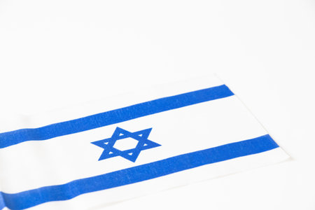 Israel flag isolated on white background close-upの写真素材