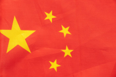 Flag of the People's Republic of China with five yellow stars on a red background close-upの写真素材