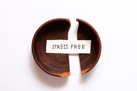 Broken ceramic plate with the inscription freedom from stress concept of overcoming stress, recovery, mental healthの写真素材