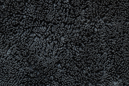 Black terry cloth background with loop texture, soft textile template for design and presentationsの写真素材