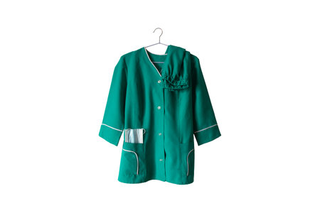 Green medical suit with mask on hangers on white background of a nurse who retired, nurse uniform from a hospital in Ukraineの写真素材