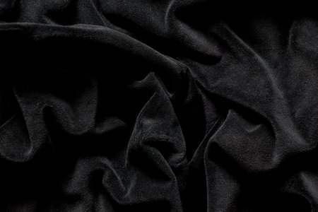 Black velour fabric wavy as background, women's velour tracksuit blackの写真素材