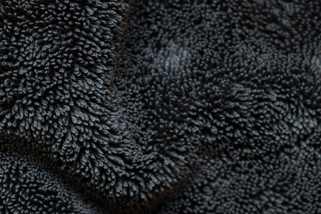 Black terry cloth background with loop texture, soft textile template for design and presentationsの写真素材