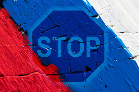 Russian flag painted with paints and stop sign, stop aggressionの写真素材