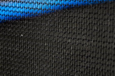 Black synthetic mesh close up for background, texture or designの写真素材