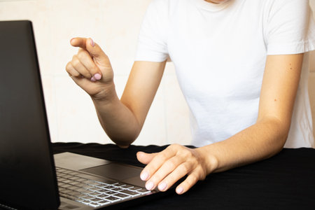 Girl working on laptop from home, freelance, operator, remote workの写真素材
