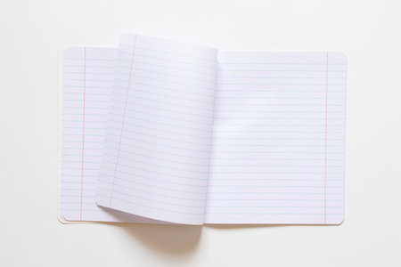 One notebook in a line, fastened with staples on a white background, educational background for school and educationの写真素材