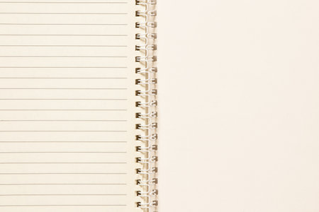 Open spiral notebook with blank lined sheets as a background for notes, planning and studyingの写真素材