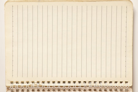 Open spiral notebook with blank lined sheets as a background for notes, planning and studyingの写真素材