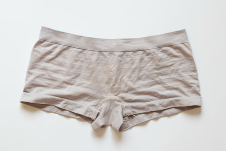 Light women's panties in the form of shorts on a white background, top view, cotton material, basic underwearの写真素材