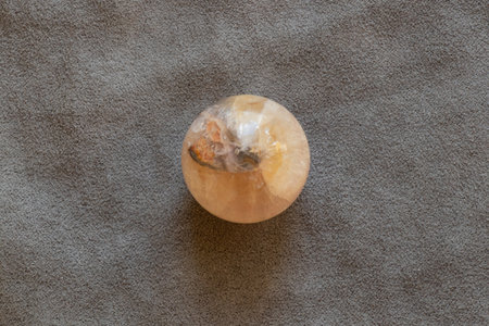 Moonstone, quartz on table on gray velour fabric for collection and interiorの写真素材
