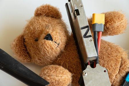 Teddy bear and Russian combat drone on white backgroundの写真素材