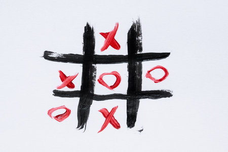 Tic-tac-toe drawn with a brush on a white background, children's board gameの写真素材