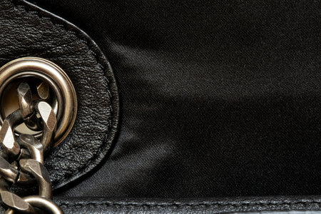 Black leather and fabric texture with metal chain - close up for background or template, women bagの写真素材