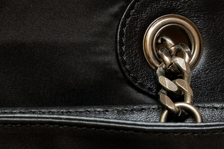 Black leather and fabric texture with metal chain - close up for background or template, women bagの写真素材
