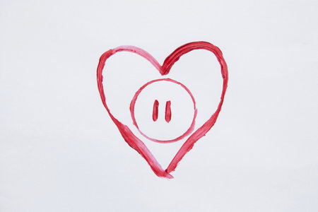 Red watercolor outline heart with pause button inside as a symbol of love and stop, hand drawn on white backgroundの写真素材