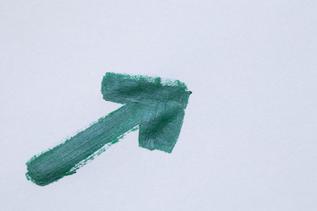 Watercolor green arrow oblique on white paper and side view on arrow, watercolor navigation icon,...
