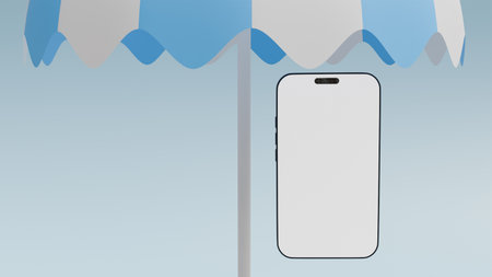 Striped white and blue beach umbrella and mobile phone with white screen on light blue background close-up, for templates and mockups on the theme of summer seasonの写真素材