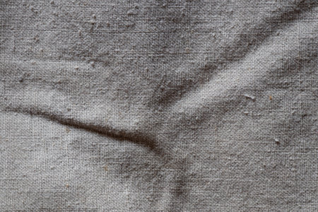 Light coarse fabric with thick threads, textured textiles of large weave as texture for background...