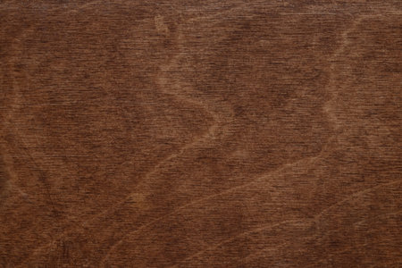 Brown wooden surface with natural texture and patterns as background or wallpaper