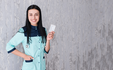 Portrait of beautiful young doctor smiling.の写真素材