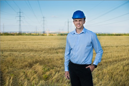 engineer or worker smiles in protective helmet