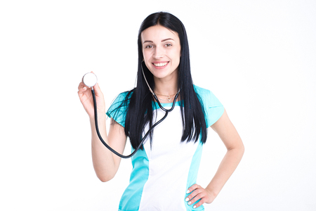 Portrait of an attractive young female doctor in white and blue coat.の写真素材