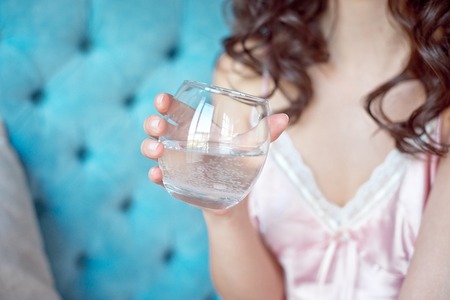 Attractive coy woman with downcast eyesの写真素材