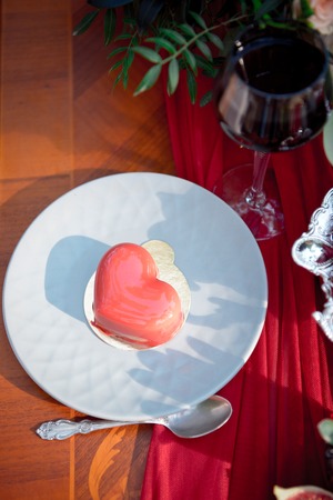 cake in the form of heart on the table Valentines Dayの写真素材