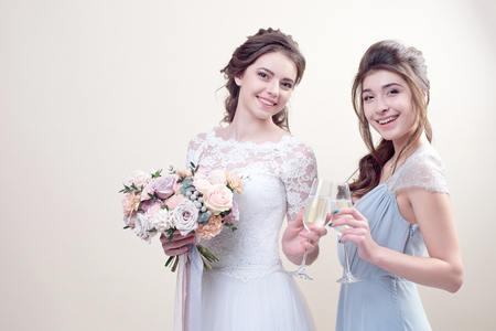 two adorable women wearing in long fashionable dressesの写真素材