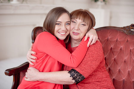 Mature Mother And Daughter Hugging.の写真素材