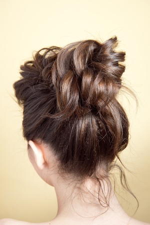 Rear view of female hairstyle volume braid.