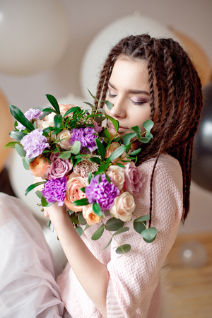 Beautiful woman with dreadlocks hairstyle.の写真素材