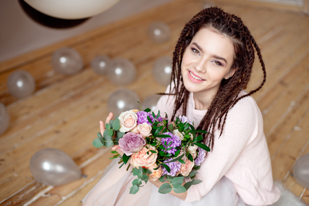 Smiling woman with dreadlocks hairstyle.の写真素材