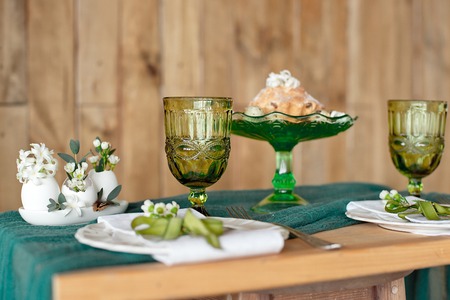 Close-up table setting with vintage rustic dishes.