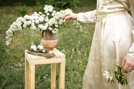 female hand touching flowers vintage colors
