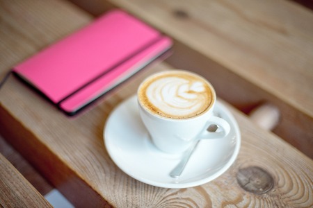 cup of coffee on wooden tableの写真素材