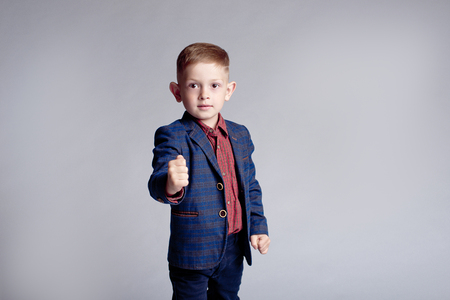 portrait of cute little boy in jacket happy smiling indoorsの写真素材