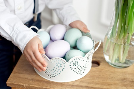 Close up of colorful Easter eggs in a basket.