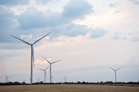 Spring or autumnal landscape with windmills on fields. Polish countryside with windmills.