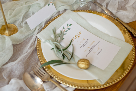 Rustic wedding table set. vintage dining table with decorations, flowers. Boho style. Table set for an event, party, date or wedding.の写真素材