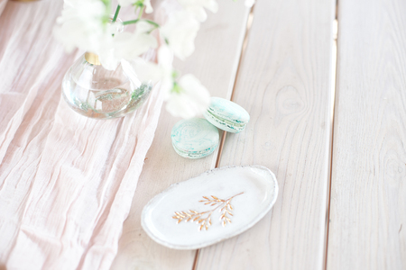 Sweet french macaroons on wood flat lay copyspace. Top voew on set of three purple macaroons on wooden board, lying diagonally on wooden table, void.の写真素材
